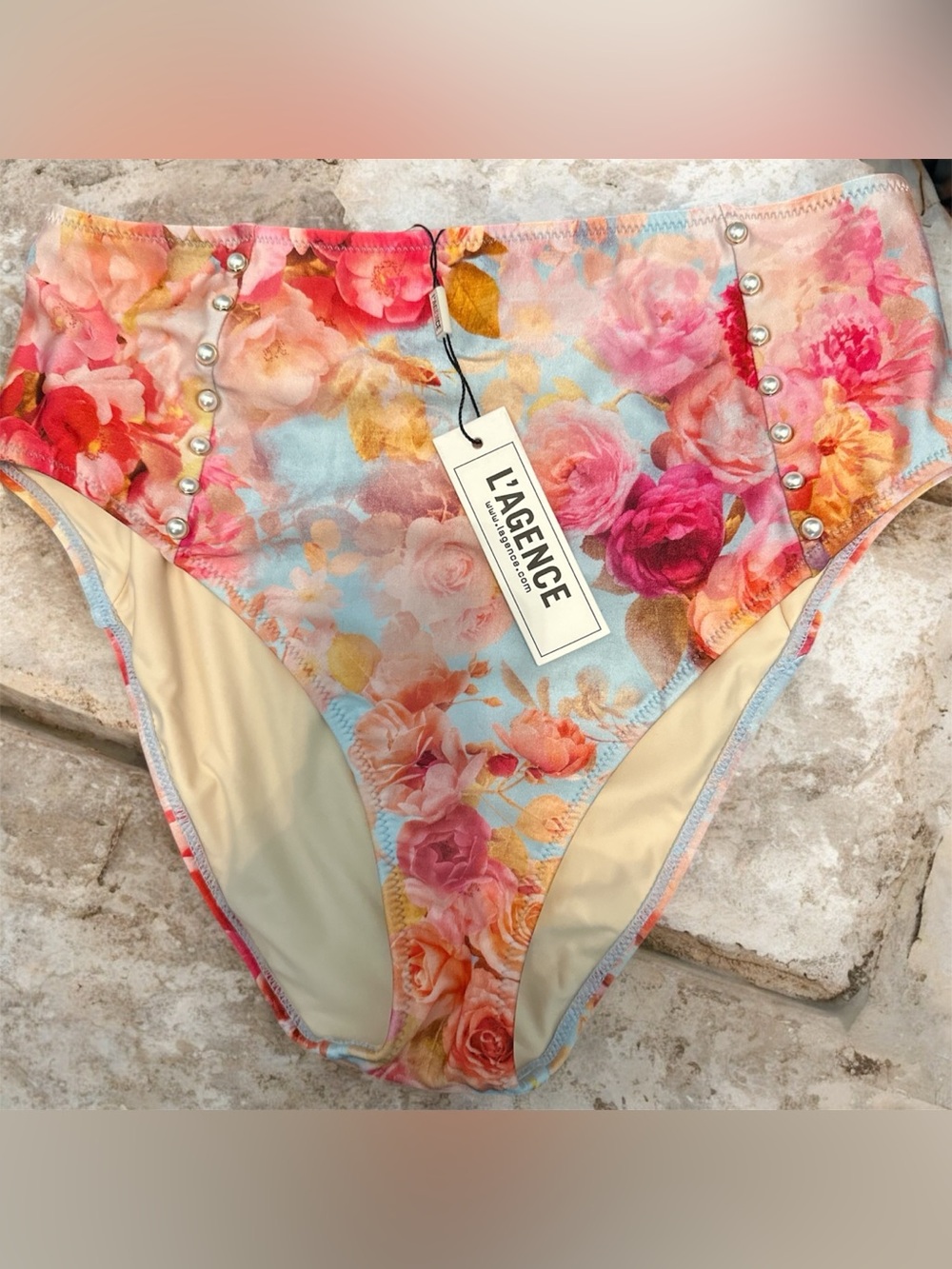 L'AGENCE floral print swimsuit bottom with side pearl stud detailing.